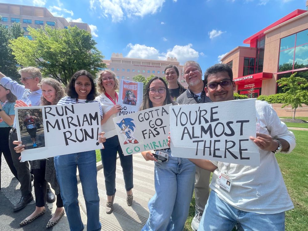 Marathon runner fans with signs