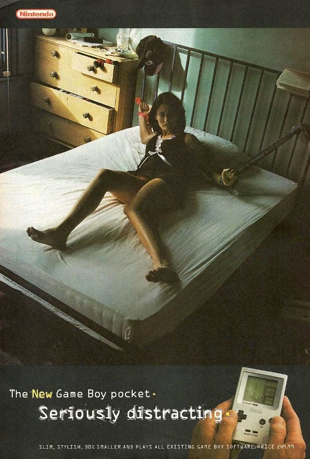 Print advert for the Game Boy pocket showing a woman tied up on a bed, implying that the Game Boy was more interesting than potentially sex