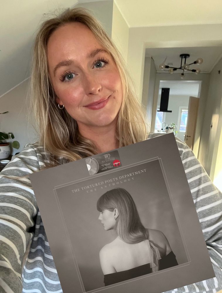 a picture of me holding the anthology vinyl, but it’s edited. I do not in fact have the vinyl yet *sad face emoji* 😭