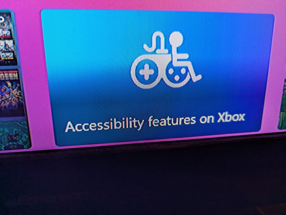 An Xbox menu screenshot. There is a promo ad that reads "Accessibility features on Xbox," along with a diagram of a controller mixed with the handicapped parking symbol. It looks like a tiny dude sitting on a controller.
