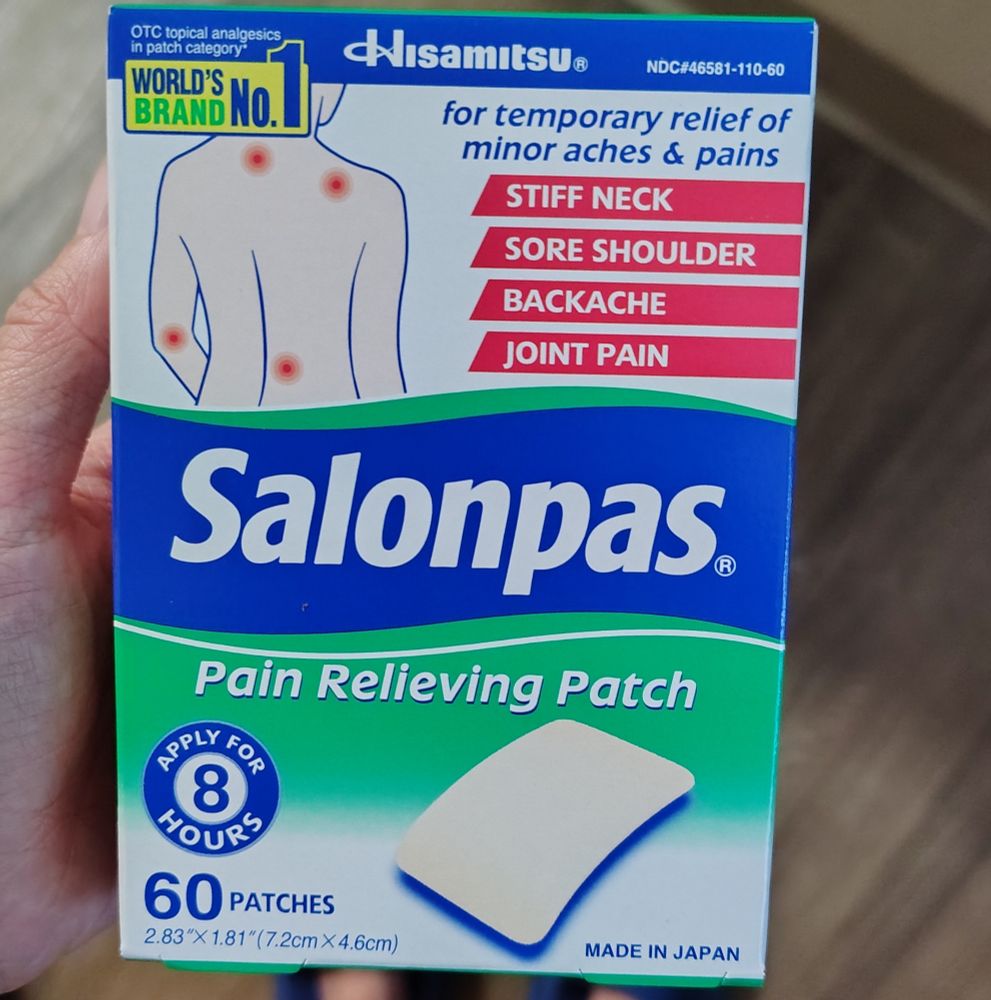 A box of salonpas in hand.