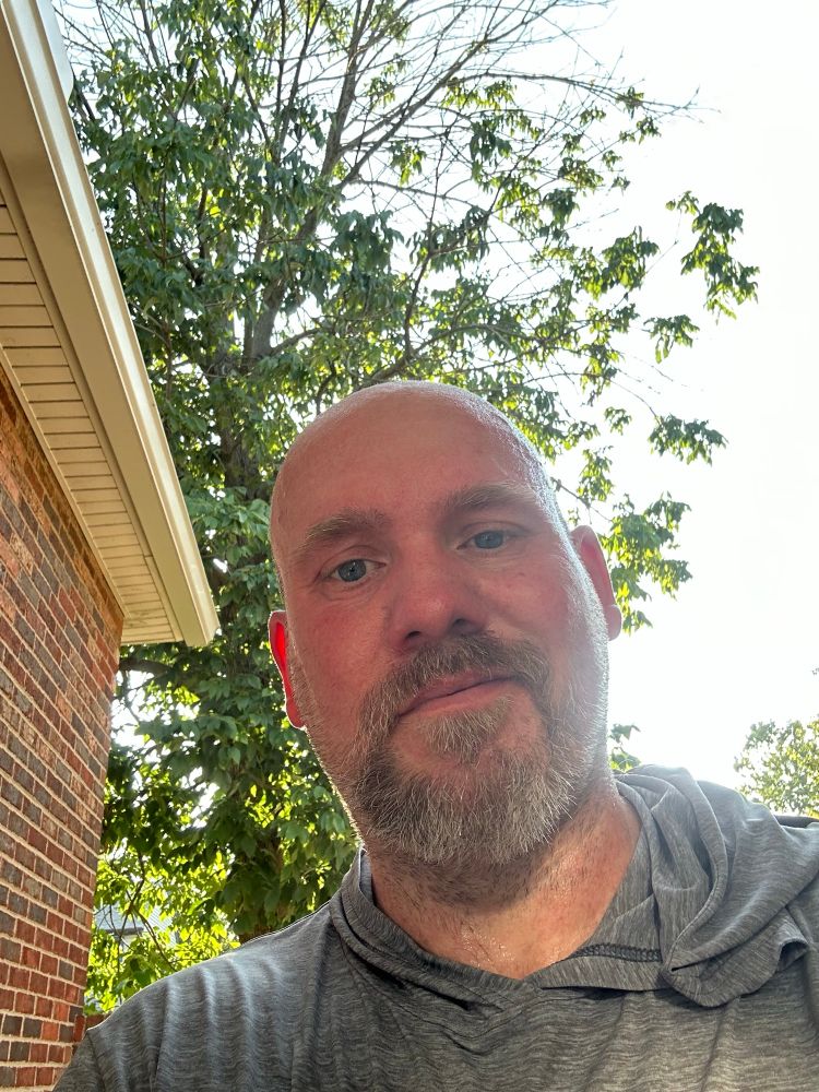 Sweaty and tired man feels all of his 50 years 