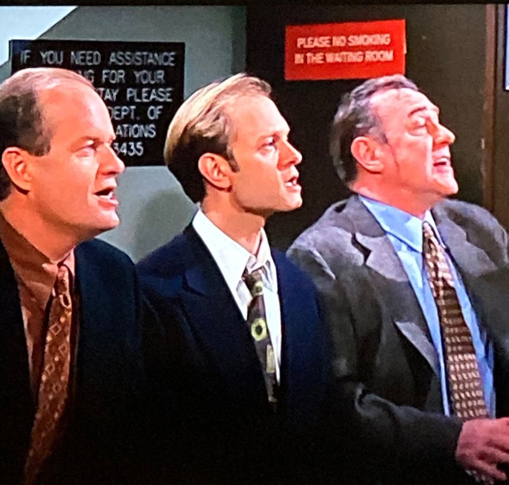 Frasier episode from 1998. Frasier, Niles and Martin Crane are in the maternity ward waiting room - waiting for Roz to give birth. The red sign asks people not to smoke. Asks them politely. This is the world we once all lived in, surrounded by toxic cigarette smoke. Now we just breathe in toxic car exhaust fumes 😐