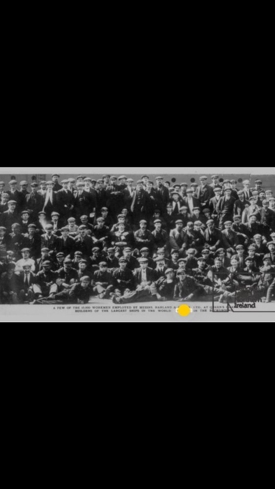 A black and white photo of the men who build Titanic at Harland and Wolff Belfast. My Granda is lying across the front 