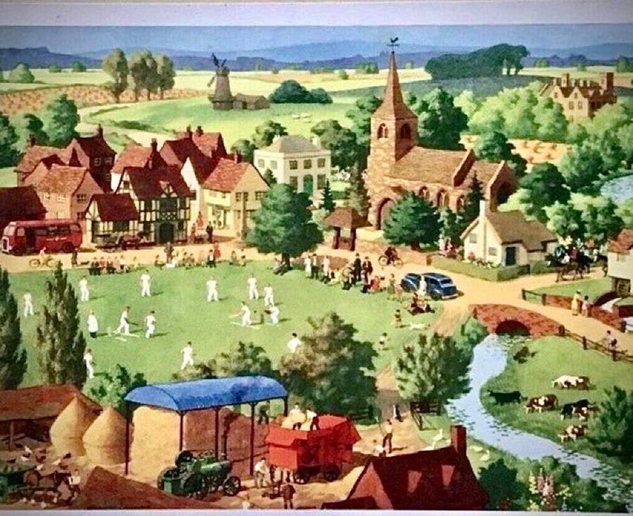 An aerial view looking down over what would be John Major’s idea of quintessentially English summer day, with a small village, meandering stream and cricket match in progress