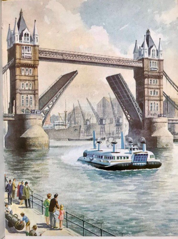 Tower Bridge is raised as the hovercraft passes beneath, watched from the bank by curious passers by