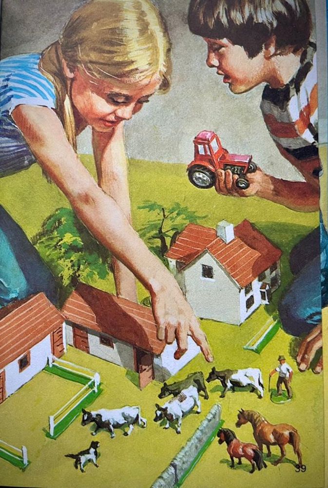 Two children playing with a toy farm.
The girl, wearing jeans, is pointing to a cow as if giving instructions to the boy, holding a red tractor, to relocate it