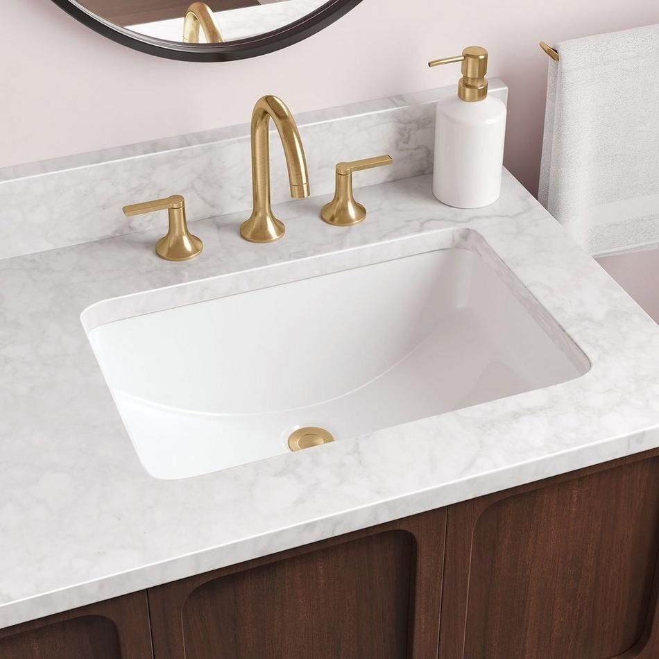 A sink with hot/cold on/off handles on either side