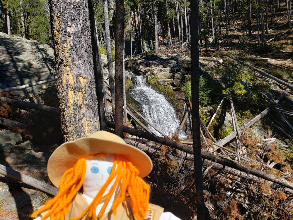 Ranger Sarah views the upper falls of Memorial Falls
