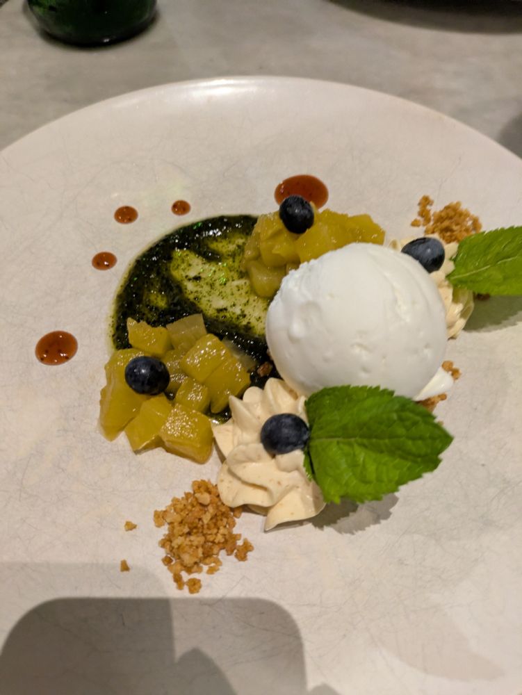 Yoghurt ice cream with pineapple, peanut and mint
