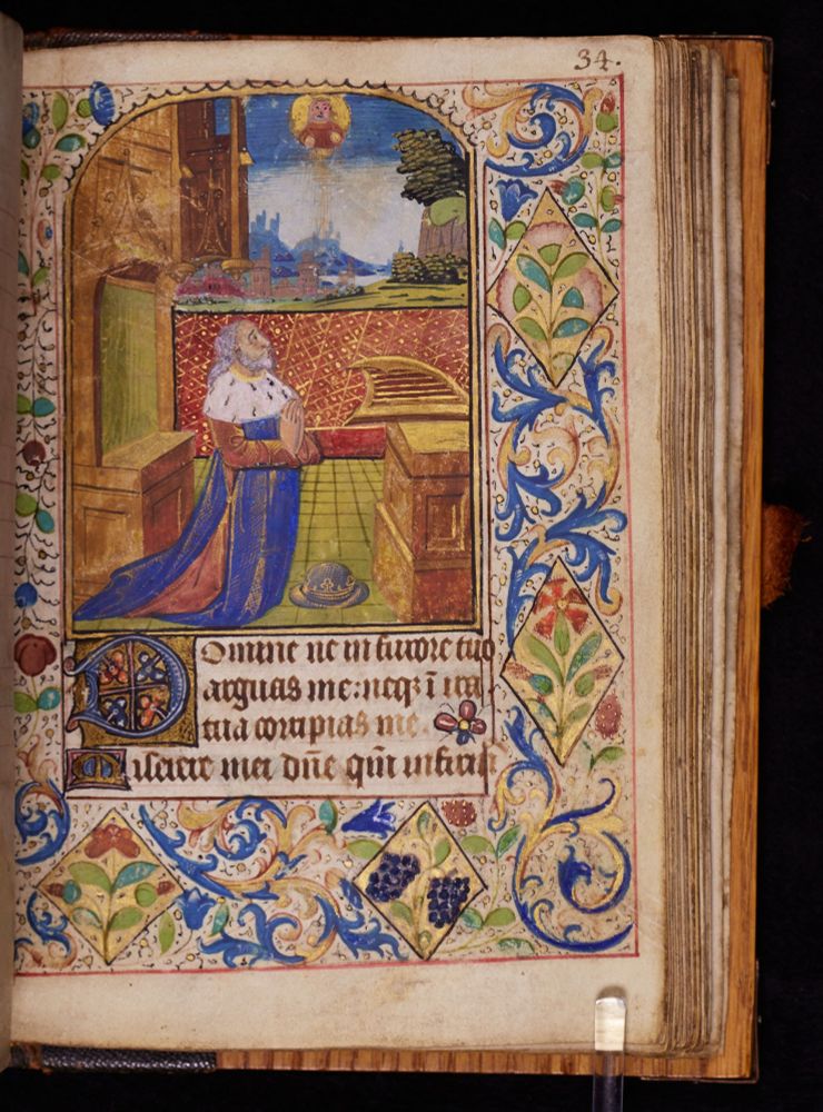 f.34r from Smith College Codex 274.  The start of a psalm, a large miniature of King David kneeling with his harp before him and an elaborate border. Four lines of text in a gothic hand starting with a 3-line illuminated D