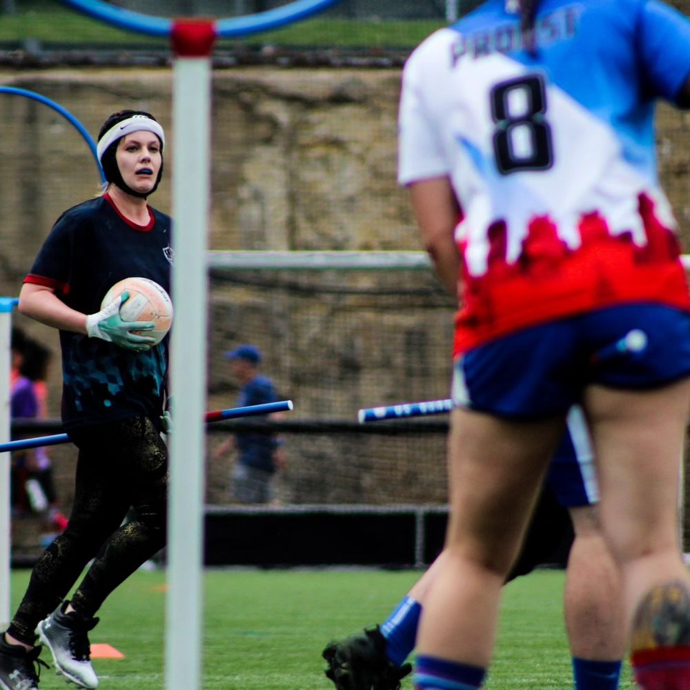 Photo of Natalie as a chaser with a quadball in her hand