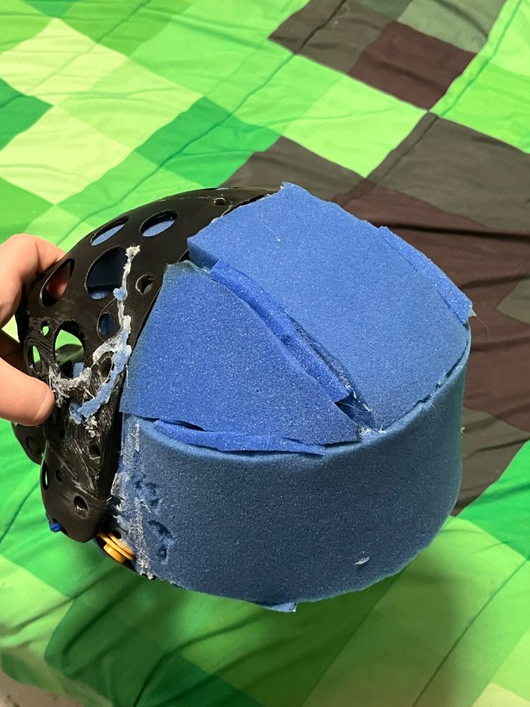 Fursuit head base with the back filled, where it previously wasn’t