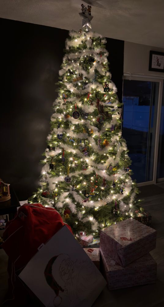 Christmas tree with presents under it 
