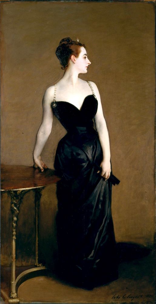 Madame X. She is standing, looking away from us, and wearing a long black dress.
