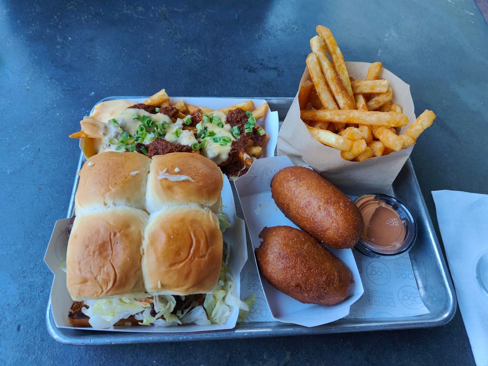 Chili cheese fries (top left), fries w/ chipotle aioli (top right), double cheeseburger on Hawaiian buns (bottom left), corn dogs (bottom right)
All on a serving tray