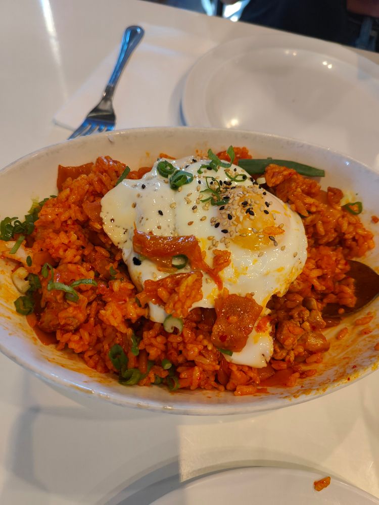Kimchi fried rice with an egg on top, served in a dish