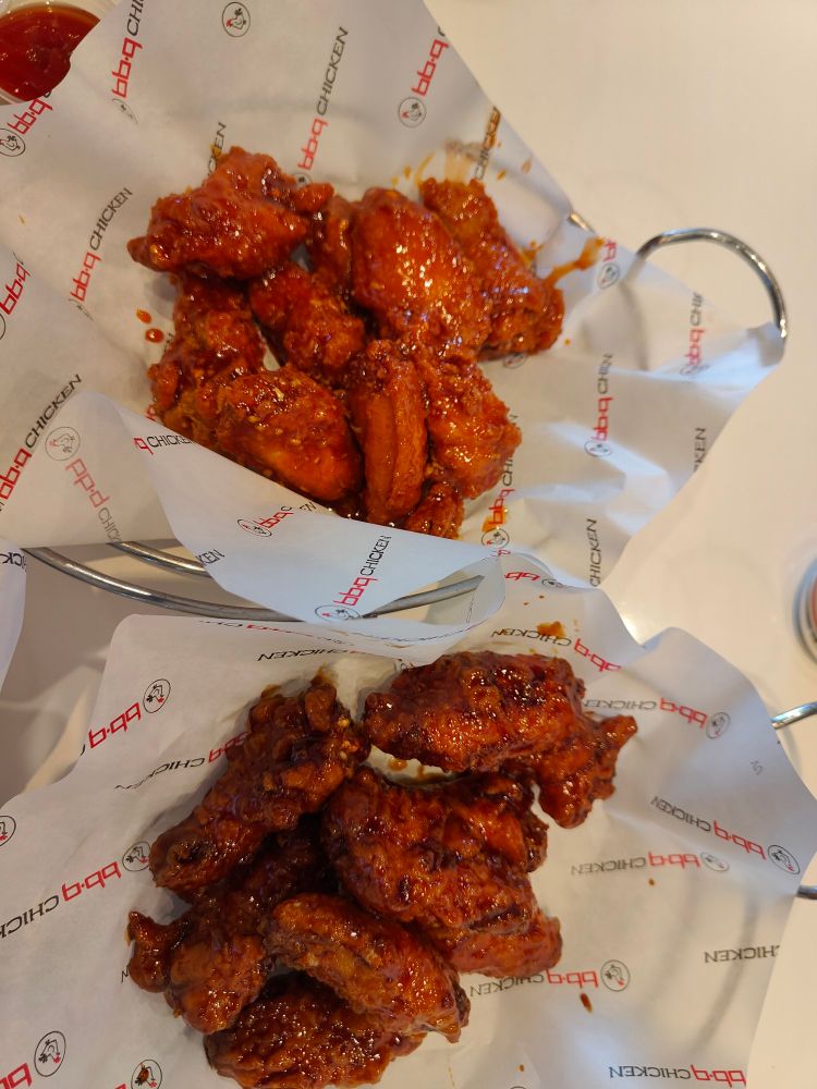 Korean fried chicken wings, flavors were Special Sauce (above) and Soy Garlic (below). Served in baskets