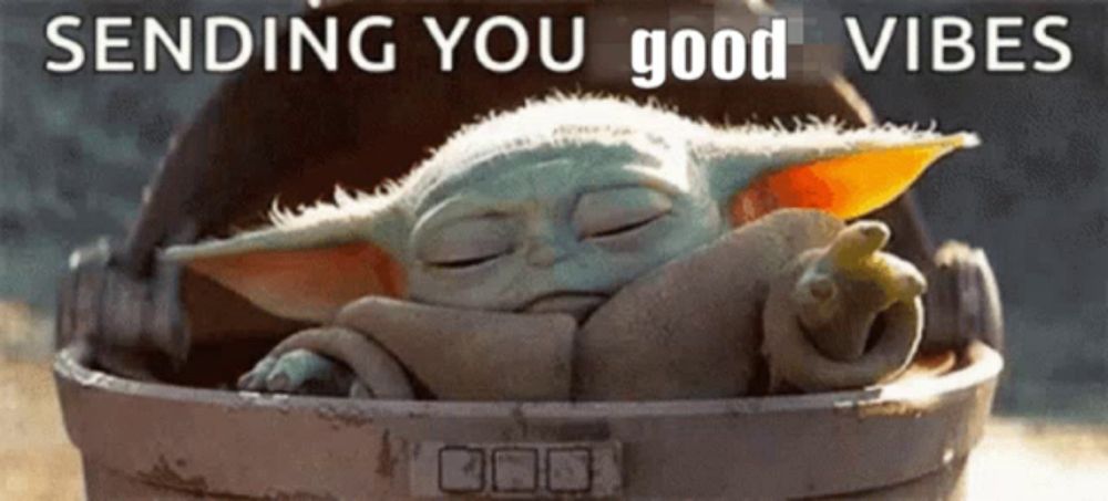 a baby yoda is sleeping in a bucket with the words `` sending you good vibes '' above it .