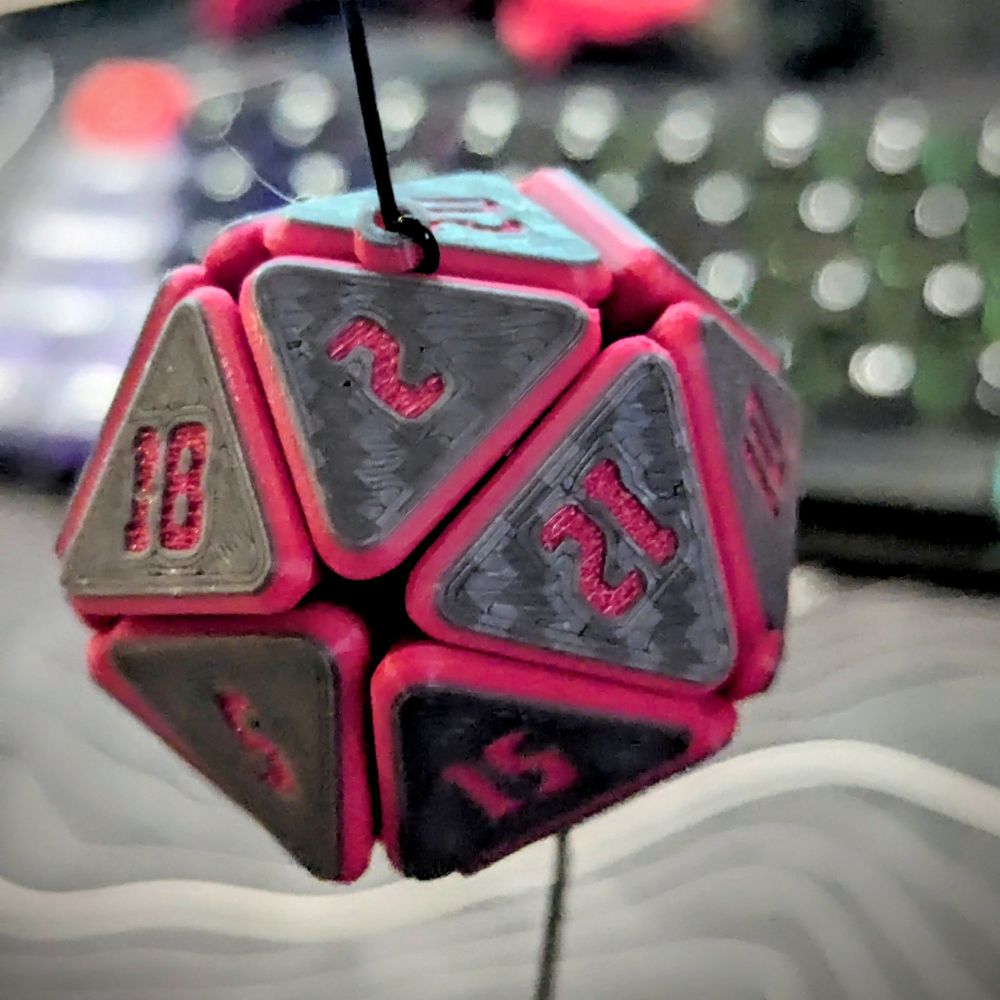 A 3d printed flexy D20 fidget toy.
