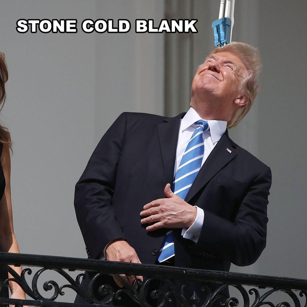 A photo of Trump looking at the sun during the eclipse without proper eye protection, but instead of the sun, it's edited to look like he's peering into a fiber optic cable. Next to the cable, it shows the text "stone cold blank."