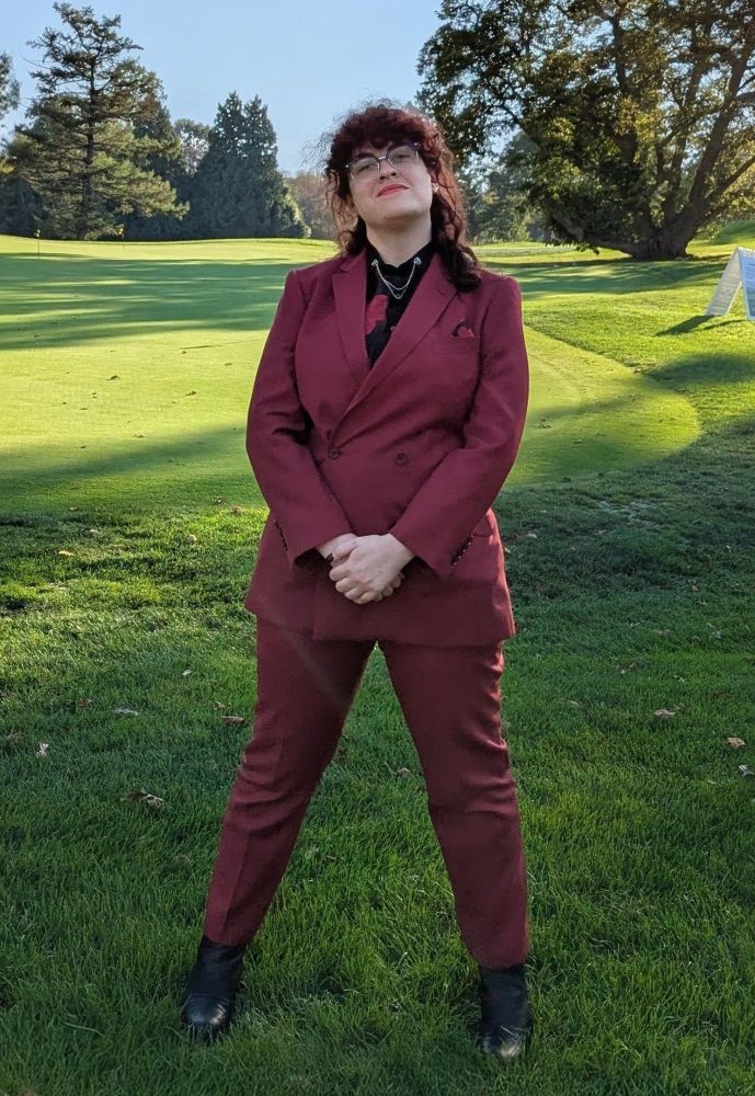 A picture of me in a burgundy red double-breasted suit