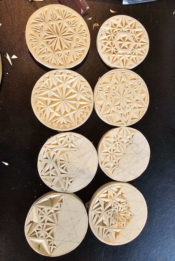 Eight round basswood ornaments. Chip carving in progress.