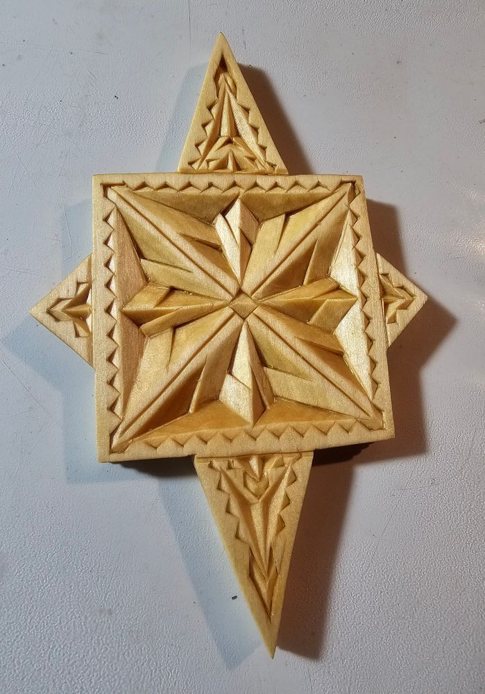 Side two of a double-sided Chip-carved ornament, basswood, finished with Tung Oil.