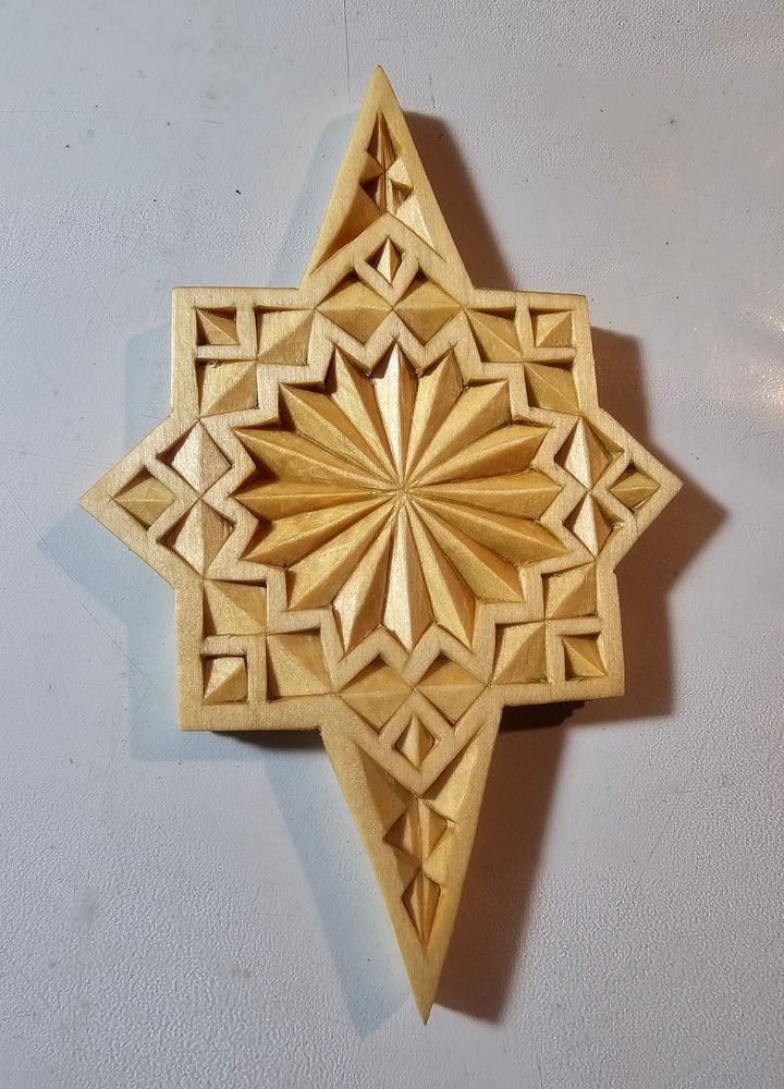 Side one of a double-sided Chip-carved ornament, basswood, finished with Tung Oil.