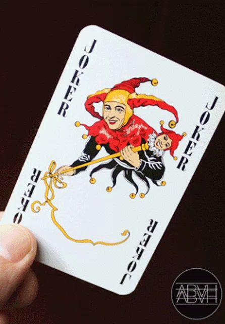header image - a hand is holding a joker card with a jester on it