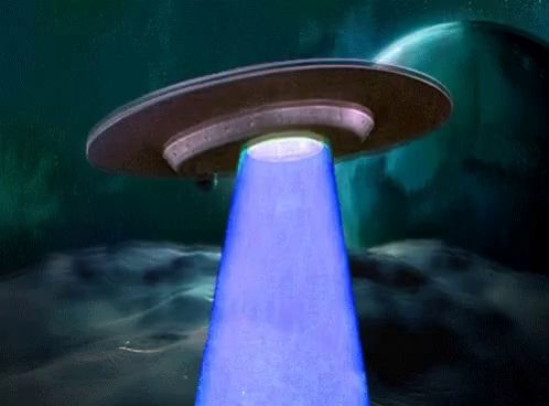 header image - a blue light is coming out of a ufo in the dark