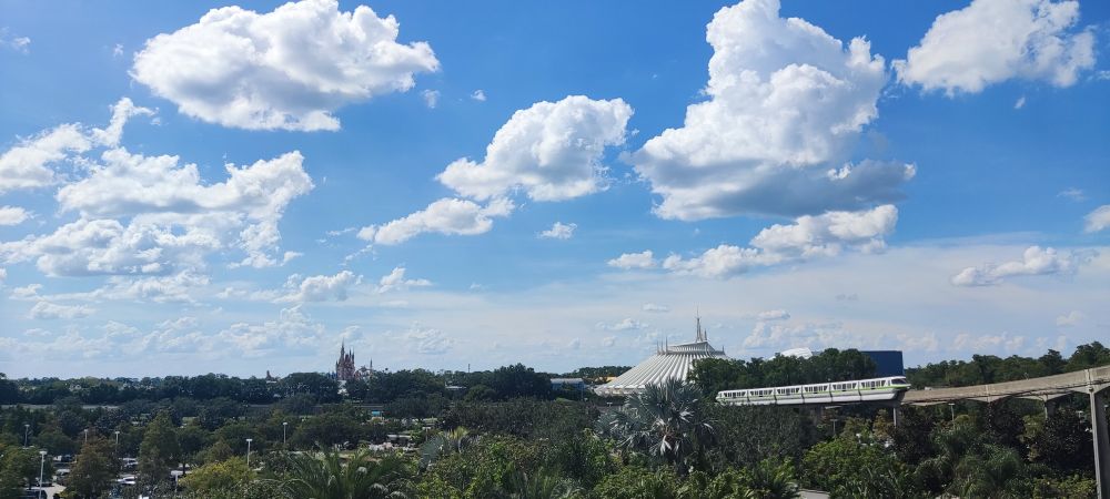 A view of Magic Kingdom from the Contemporary with a monorail approaching. 