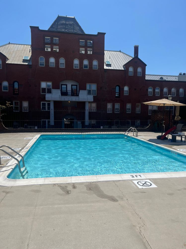 the pool at my condo with the historic East Capitol Street Car Barn in the background