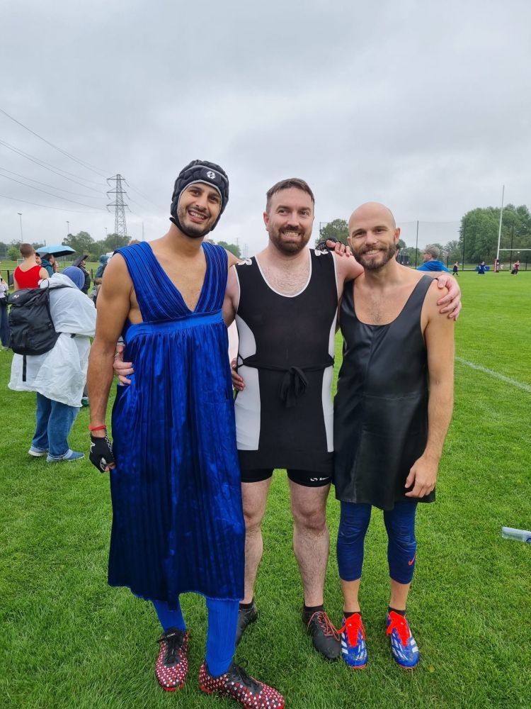 3 men in dresses and rugby gear
