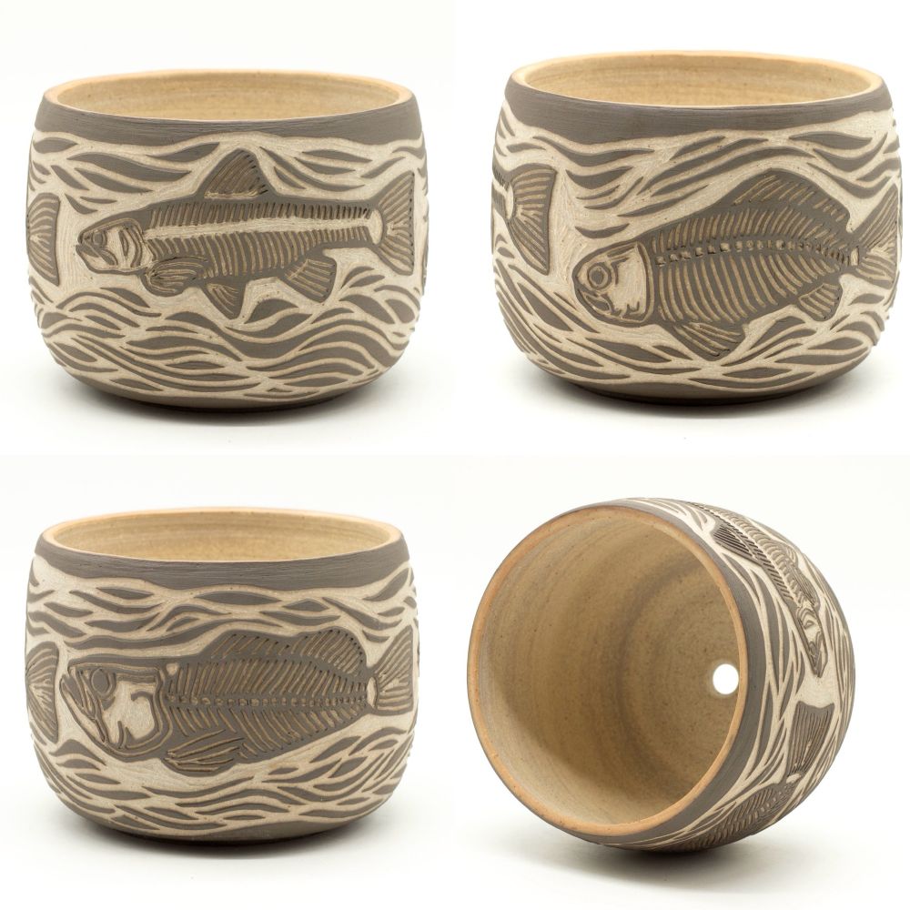 Ceramic planter carved with designs of skeletal fish 