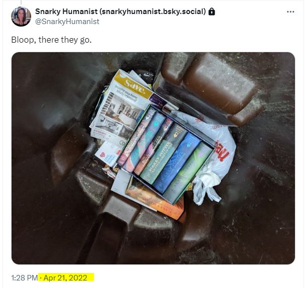 Screenshot of a tweet from 2022 showing a picture of all my Harry Potter books at the bottom of my trash can.