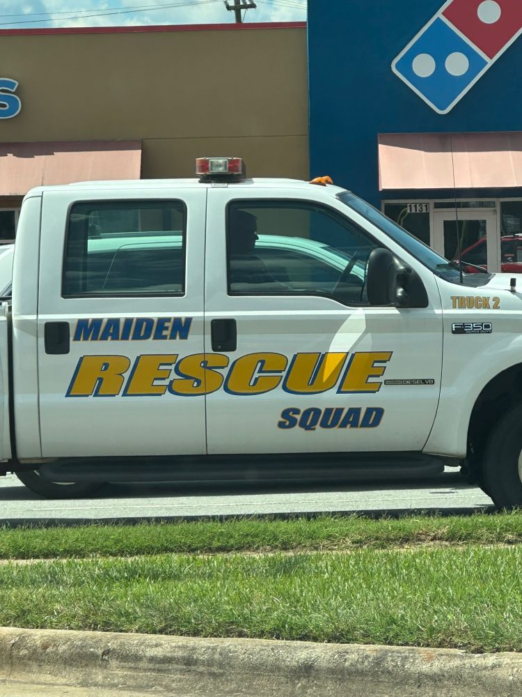 a work truck that says “MAIDEN RESCUE SQUAD” on the side
