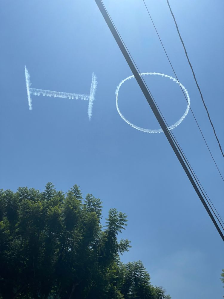 Skywriting that says “HO”