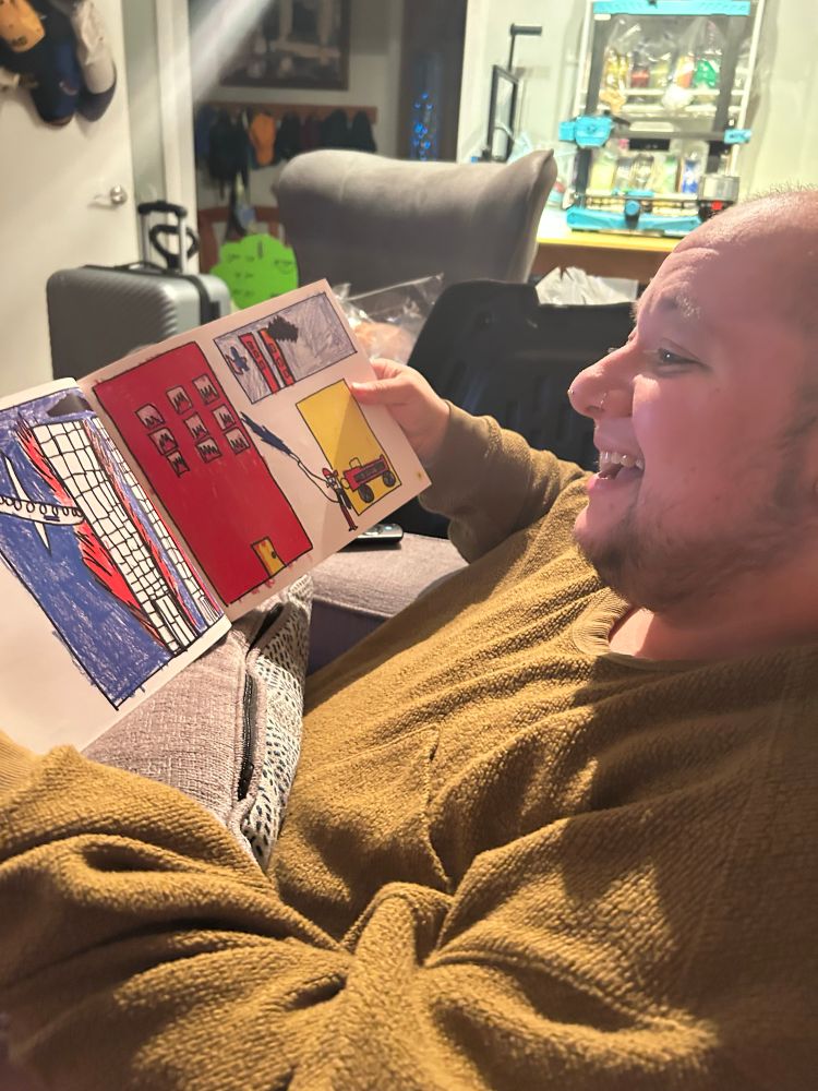 Reading a book with a childs drawing of 9/11