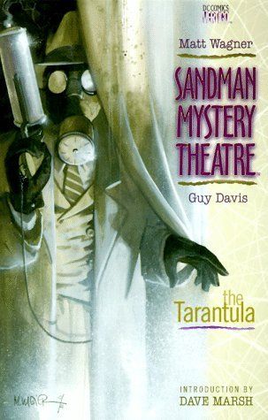 A photo of a man in a suite wearing a gas mask and holding a gun-shaped cylinder. Text reads "Matt Wagner/Sandman Mystery Theatre/Guy Davis