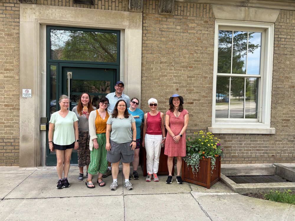 8 YTI employees outside Dolgen Hall, getting ready to take a walk together.