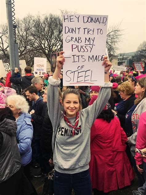 Melissa Benoist, during the International Women's Day march, holds up a sign that says: HEY DONALD, DON'T TRY TO GRAB MY PUSSY -- IT'S MADE OF STEEL.