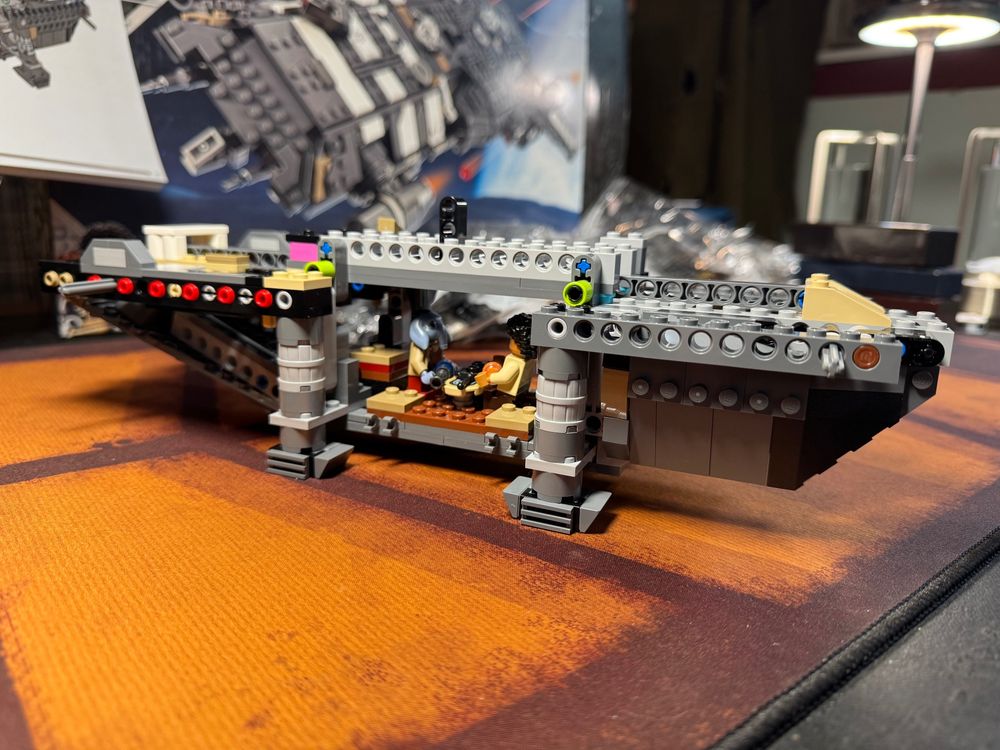 The LEGO OnyxCinder model after bag #5. The Wim and Neel figures are inside, Neel standing, Wim seated, both facing the table.