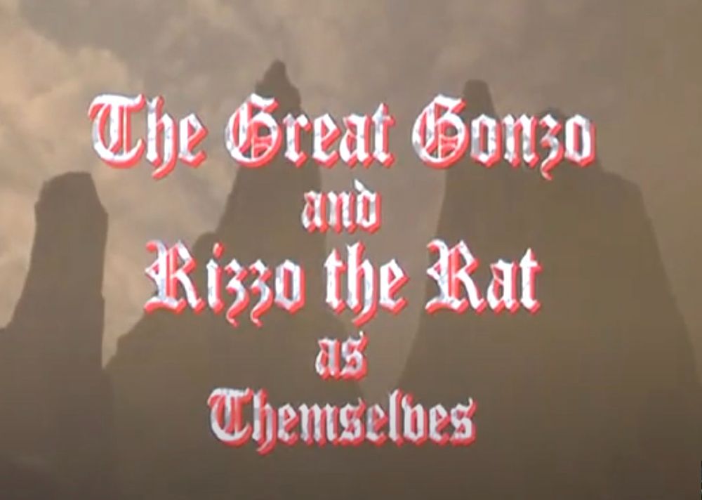 screenshot from the opening credits of MUPPET TREASURE ISLAND (1996) which reads in gothic lettering "The Great Gonzo and Rizzo the Rat as Themselves"