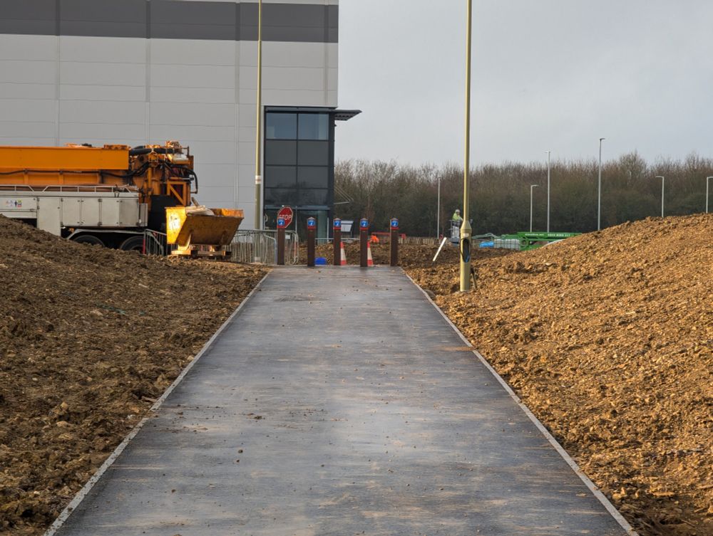 5 vertical posts making a cycle path inaccessible in the far background.