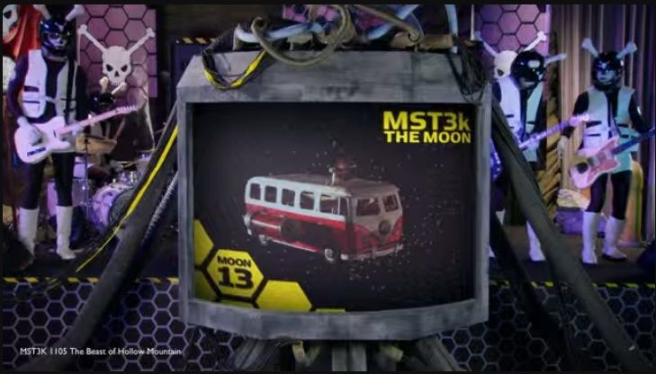 The Skeleton Crew jams on guitars while we see Pearl's Widowmaker VW bus on a TV screen that says "MST3K - The Moon" from the Beast of Hollow Mountain episode.