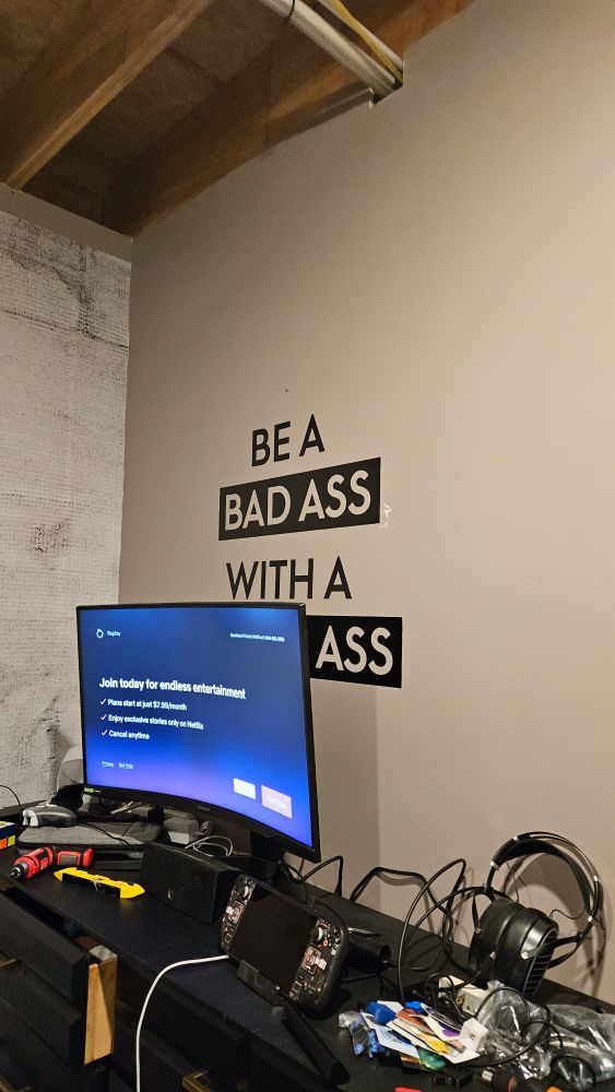 A wall decal that says "Be a Bad ass with a good ass"