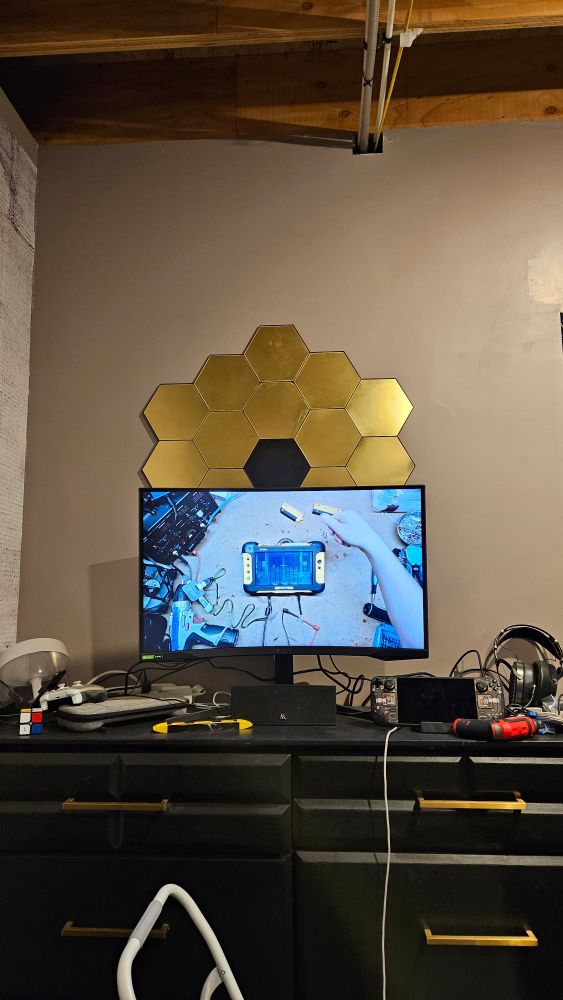 JWST model hung up behind a monitor 