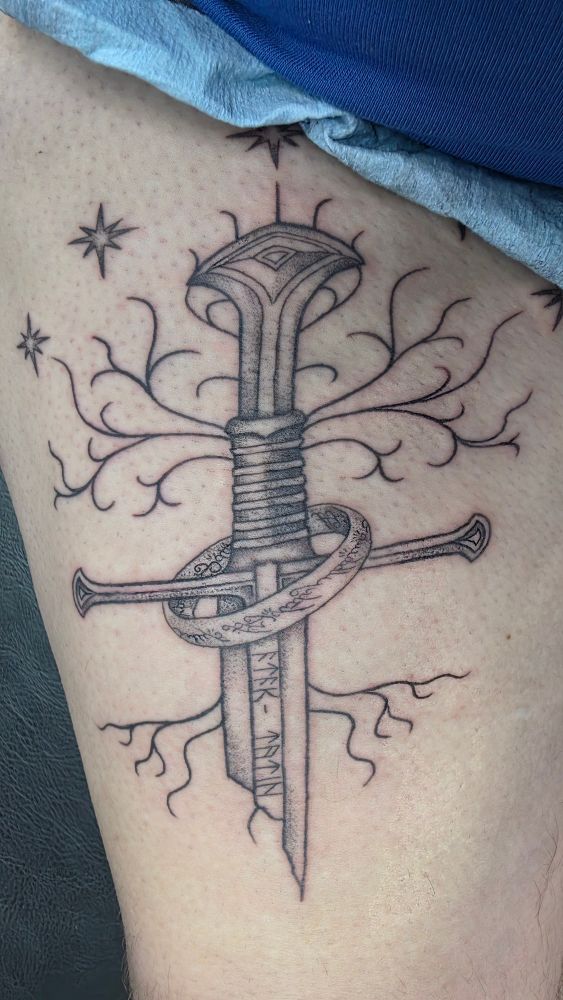 Nick shows off his new tattoo. Narsil and the one ring