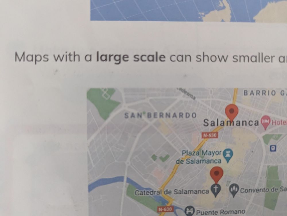 CLIL Social Sciences class book screenshot teaching what small scale and large scale maps are. This is a concept that is completely counterintuitive and shouldn't be teach to kids the age of my daughter.